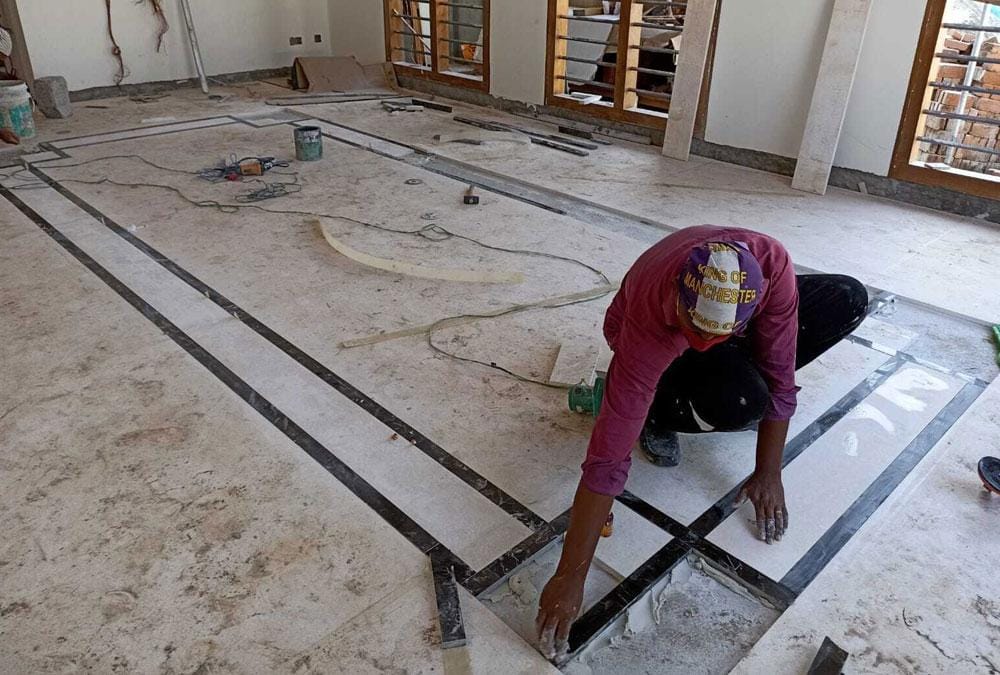 Why does marble have different shades in different slabs?